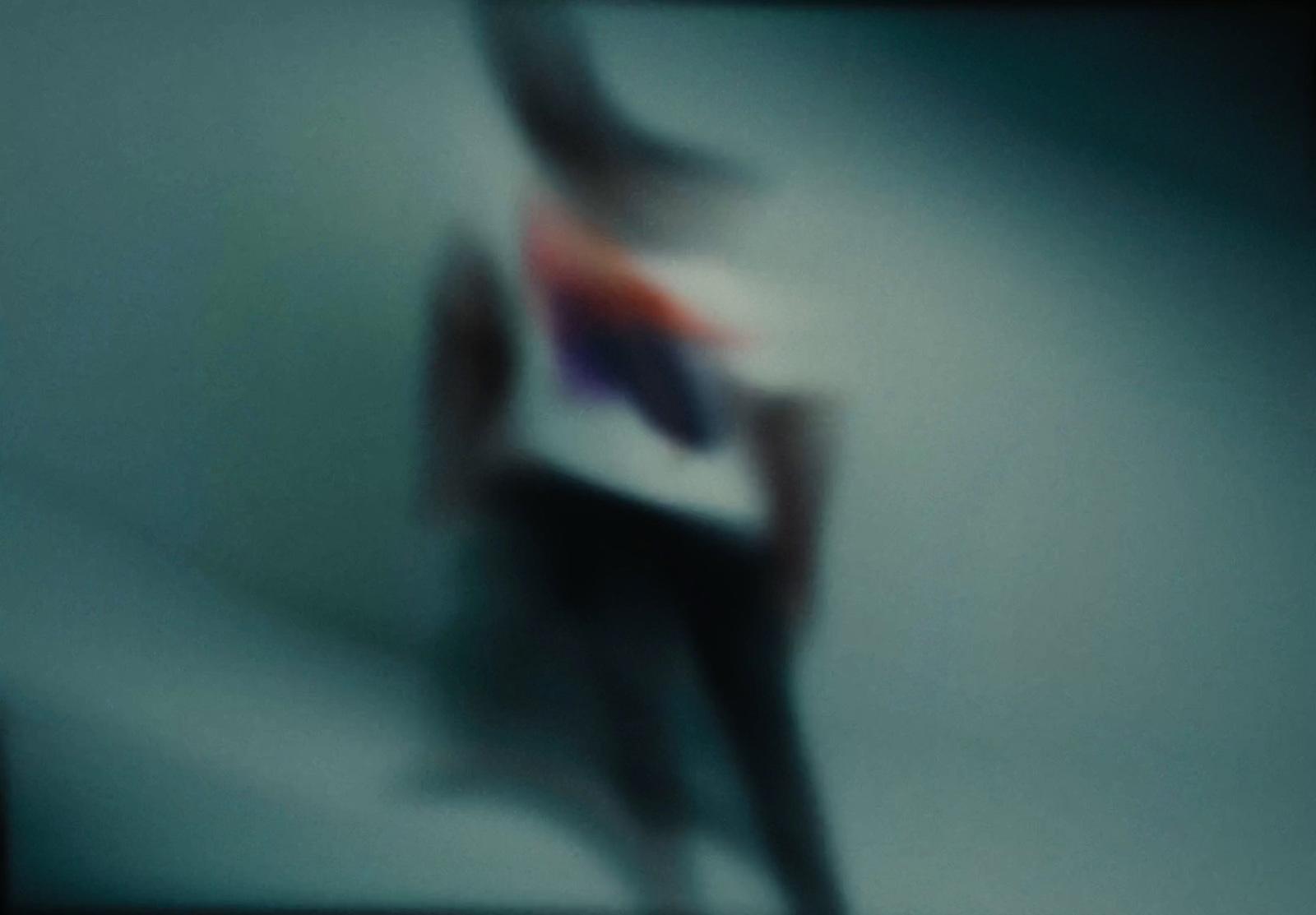 a blurry photo of a person holding a cell phone