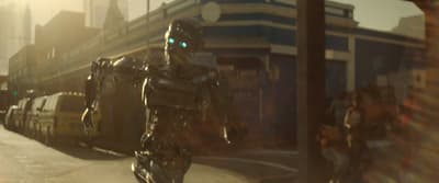 a robot walking down a street next to a tall building
