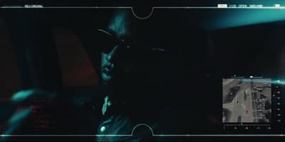 a man driving a car in the dark
