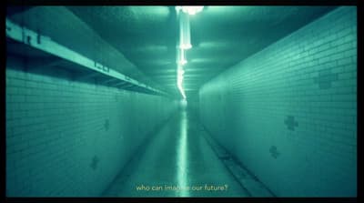 a long hallway with a light at the end of it