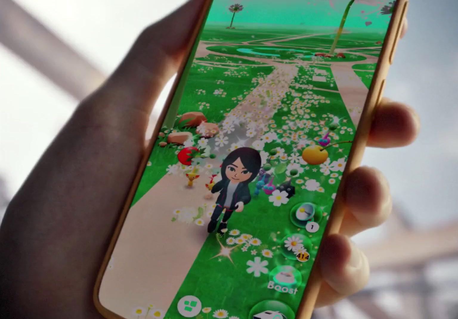 a person holding a cell phone in their hand