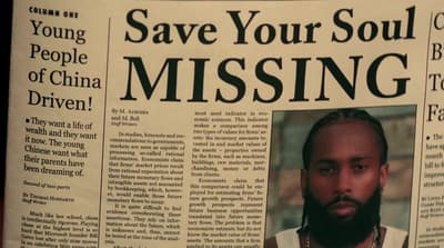a newspaper article with a picture of a man with a beard