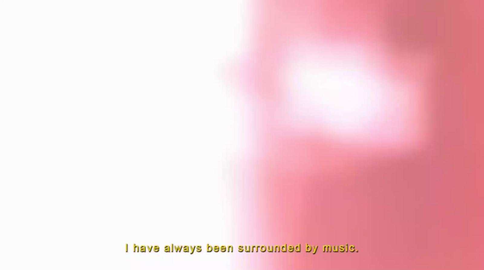 a blurry image of a pink and white background