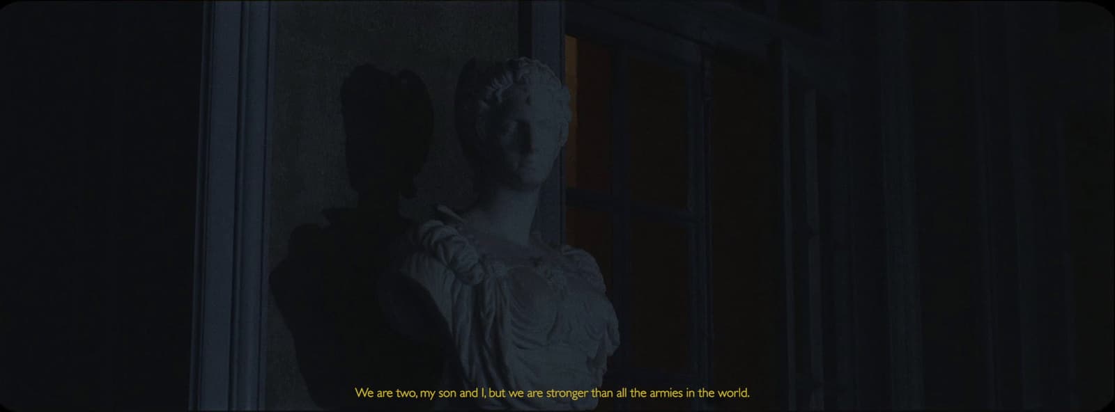 a statue of a woman in a dark room