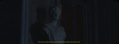 a statue of a woman in a dark room
