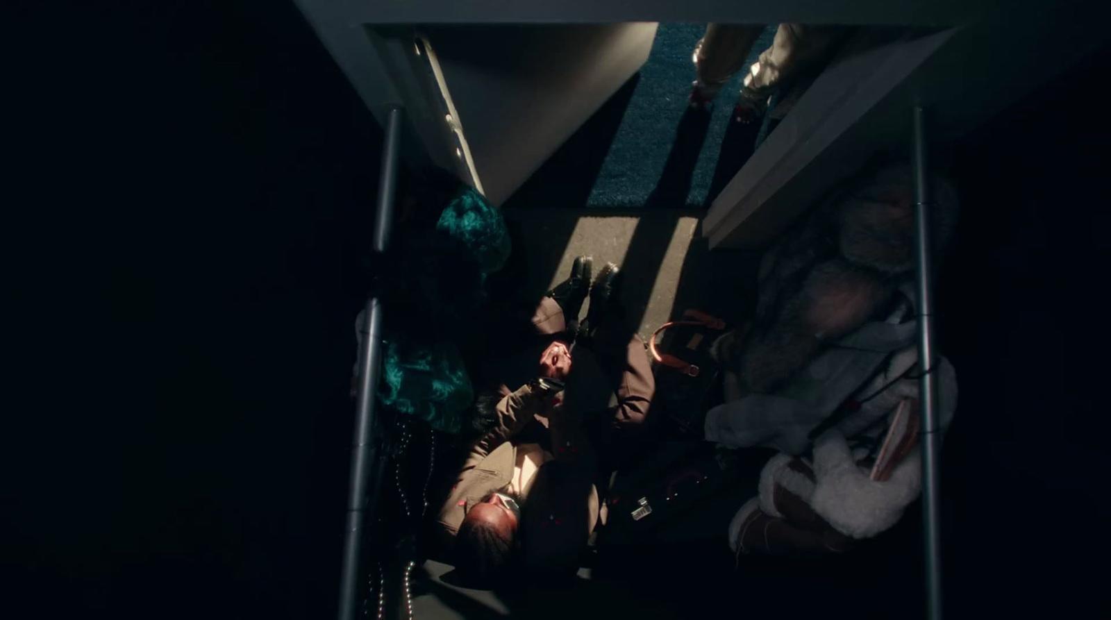 a group of people laying on the ground in the dark