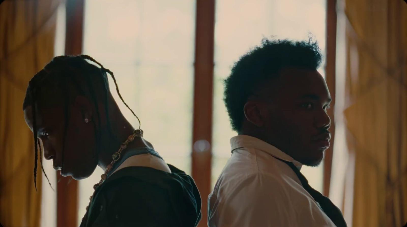 a couple of men standing next to each other