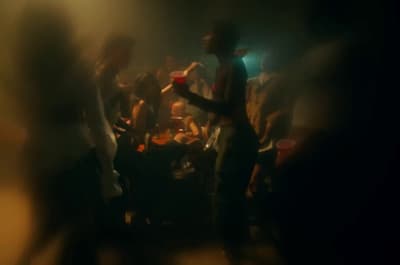 a blurry photo of a group of people dancing