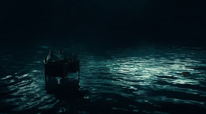 a group of people in a boat in the water
