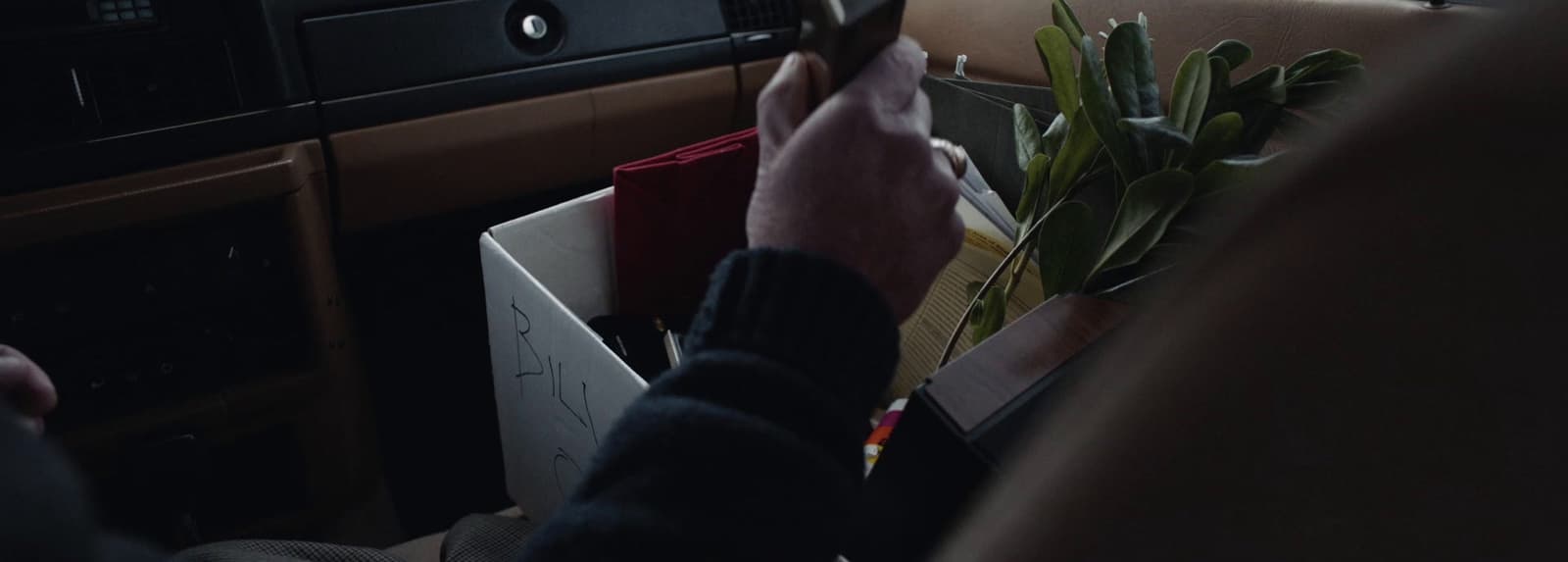 a person holding a cell phone in their hand
