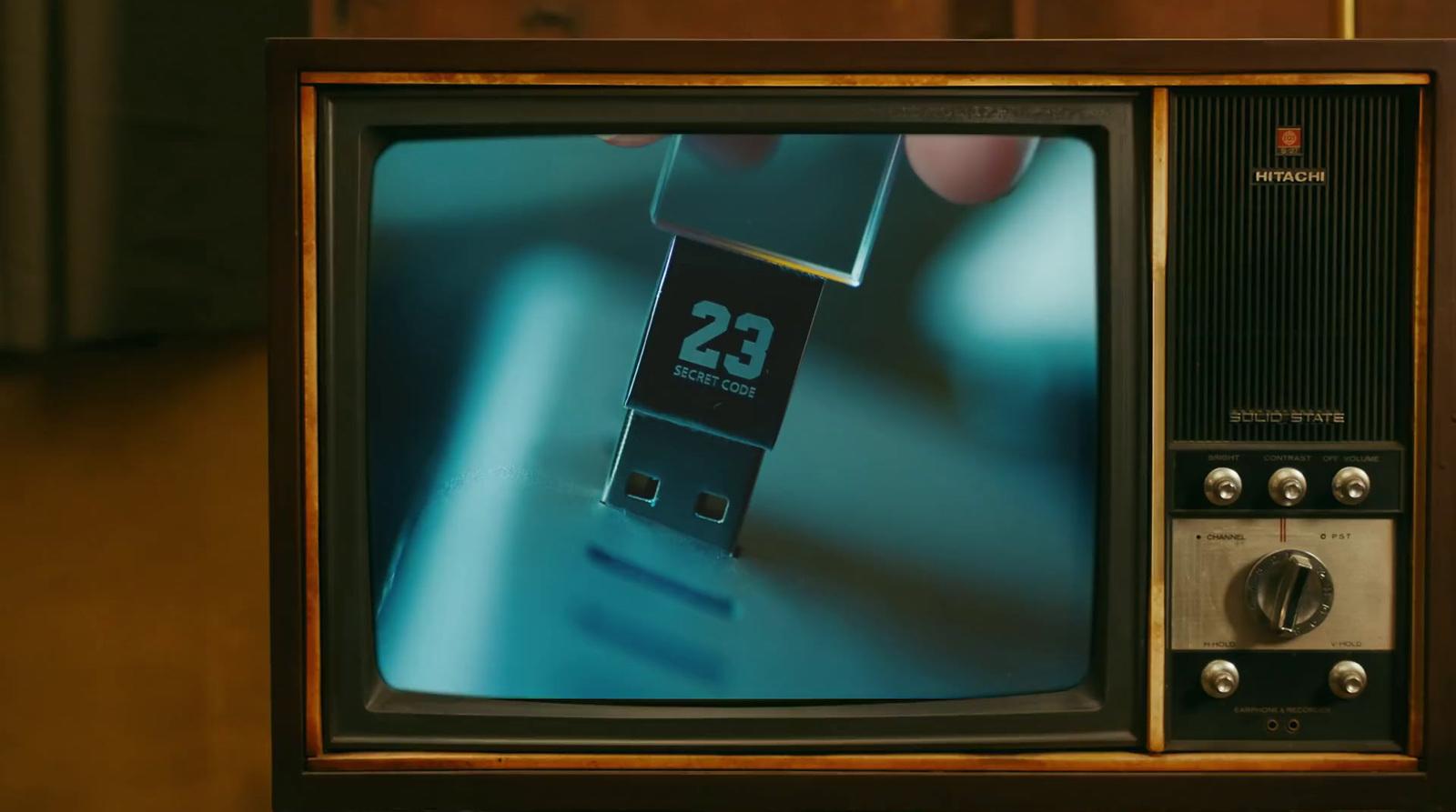a small television with a small clock on it