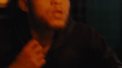 a blurry photo of a man brushing his teeth
