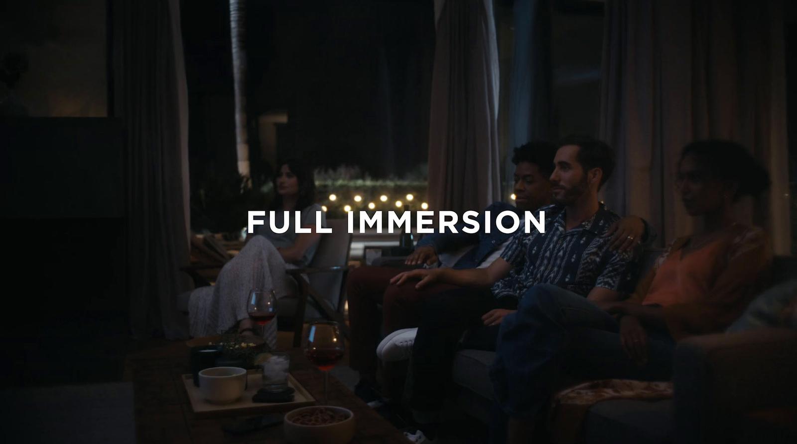 a group of people sitting around a living room