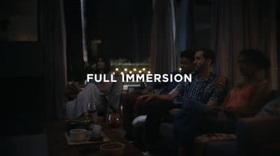 a group of people sitting around a living room