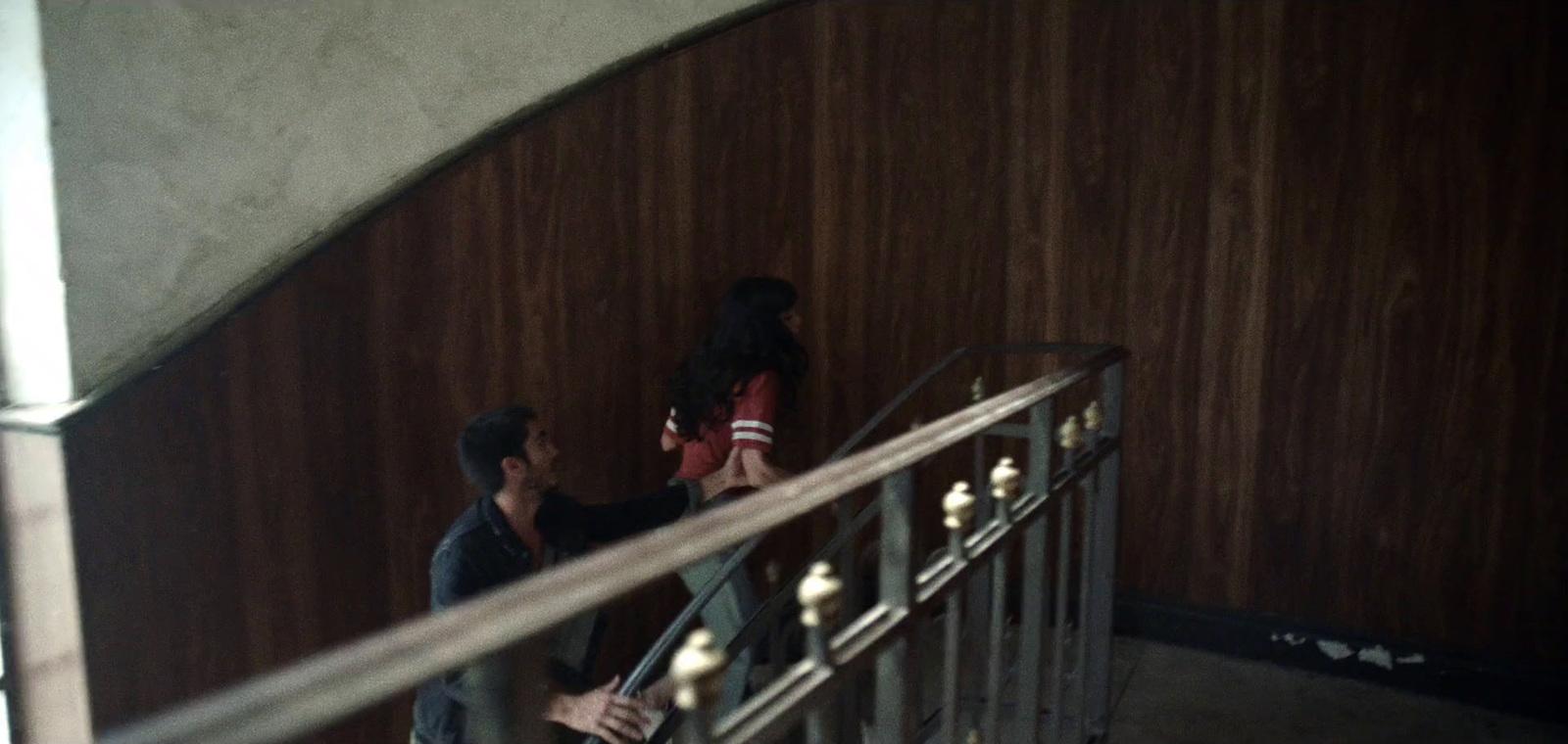 a couple of people that are standing on some stairs