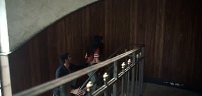 a couple of people that are standing on some stairs