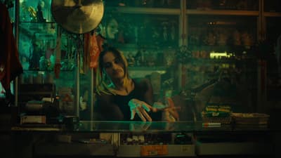 a woman sitting at a counter in a store