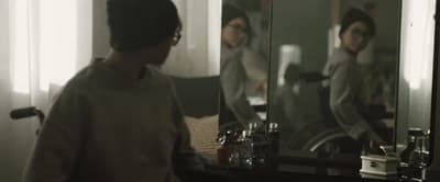 a man standing in front of a bathroom mirror