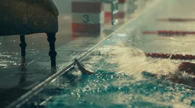 a person swimming in a pool of water