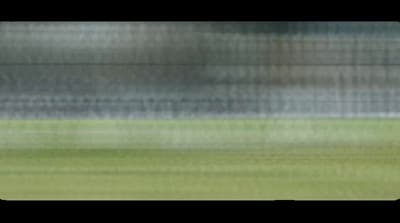 a blurry photo of a soccer ball on a field