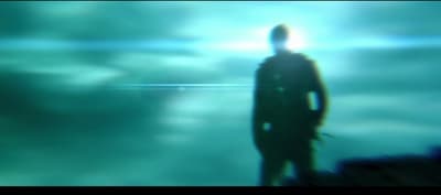 a blurry image of a man standing in the water