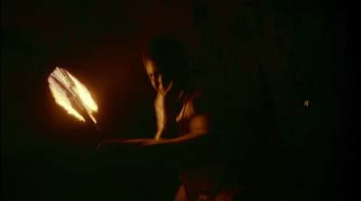 a person holding a lit object in their hands