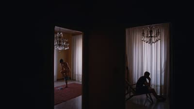 a person sitting in a chair in a room