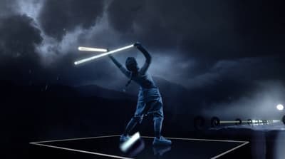 a man holding a tennis racquet on top of a tennis court