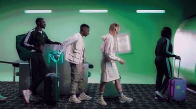 a group of people standing around with luggage