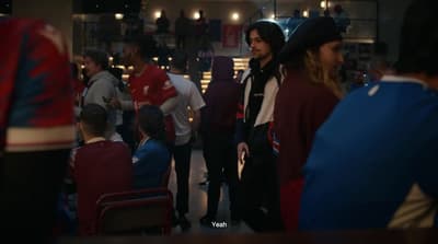 a group of people standing around each other