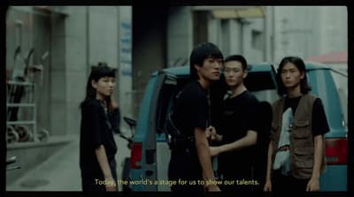 a group of people standing in front of a van