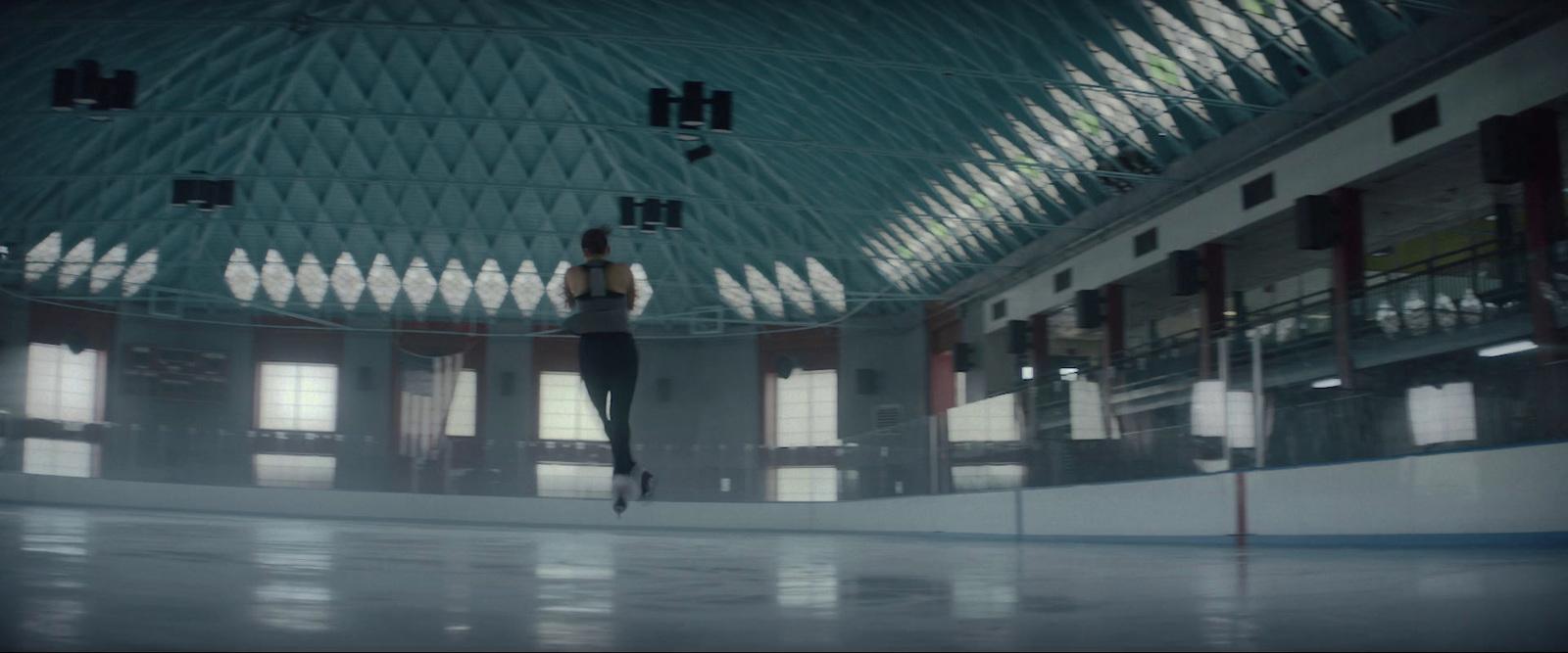 a woman is standing in a large building
