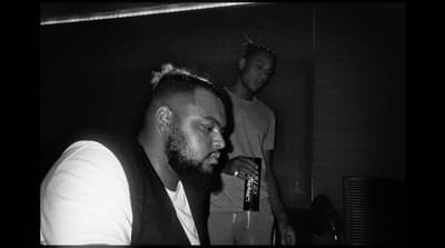 a black and white photo of two men