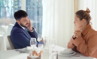a man and a woman sitting at a table