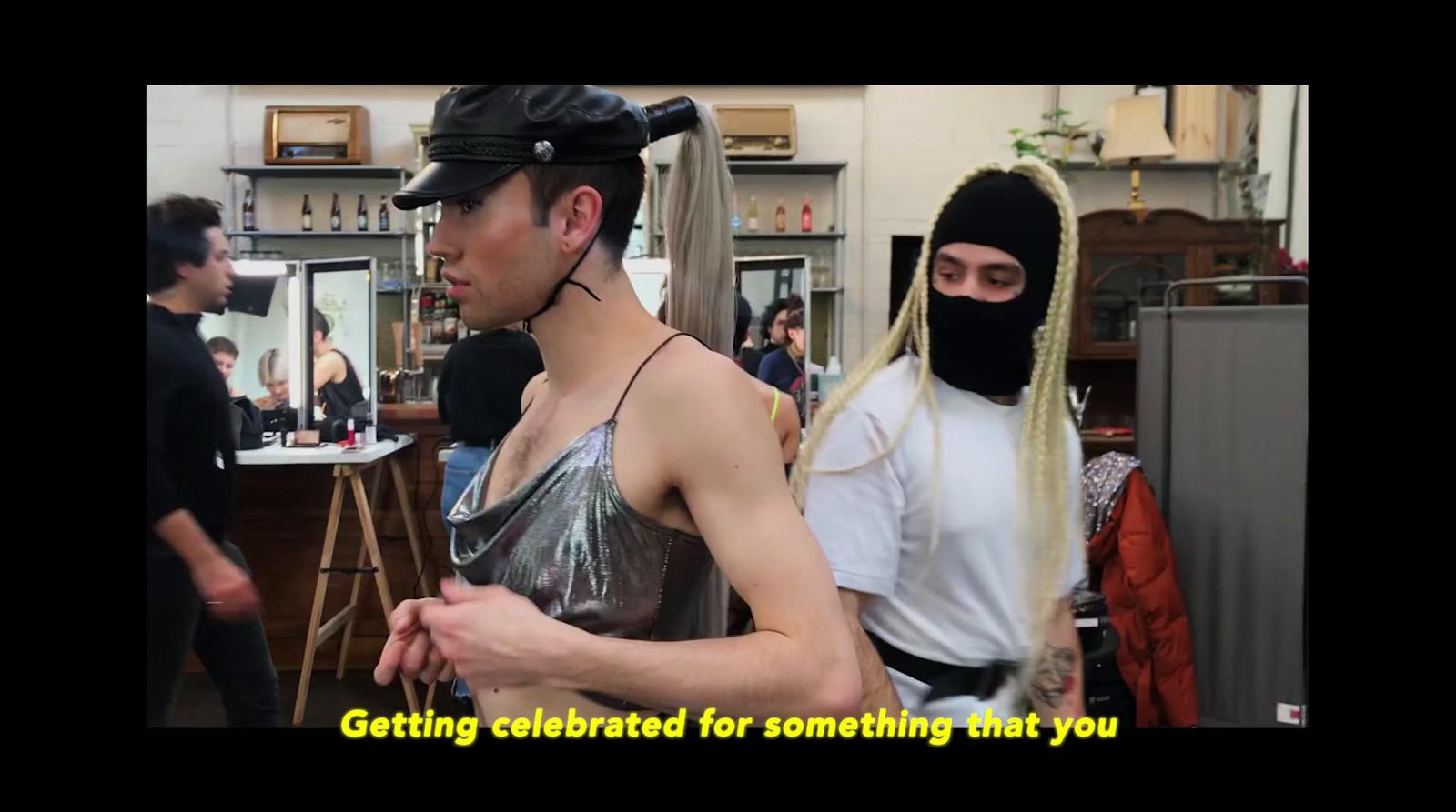 a man wearing a mask and a woman wearing a costume