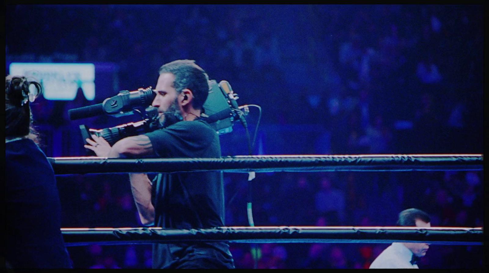 a man with a microphone in a ring