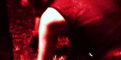 a blurry image of a person holding a cell phone