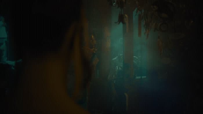 a group of people standing in a dark room