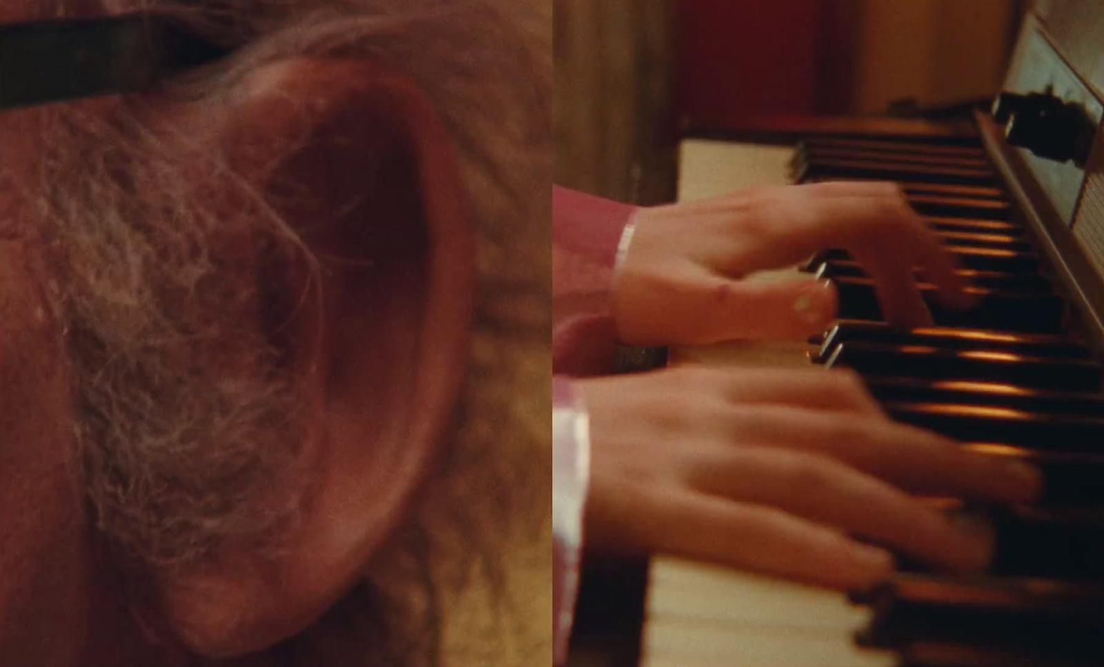 a close up of a person playing a piano