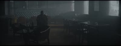 a person standing in a dark room in the dark