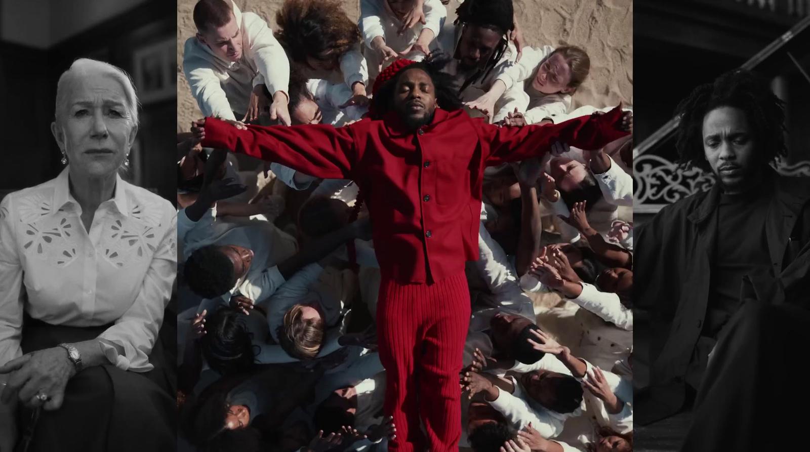 a man in a red suit standing in front of a group of people