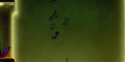 a blurry photo of a person's foot in a bathtub