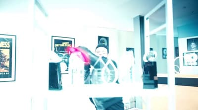 a man standing in front of a mirror in a room