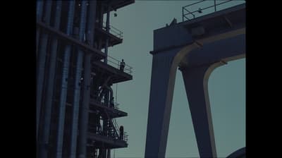 a tall building next to a very tall tower