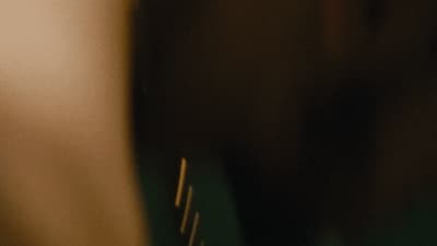 a blurry photo of a person holding a toothbrush