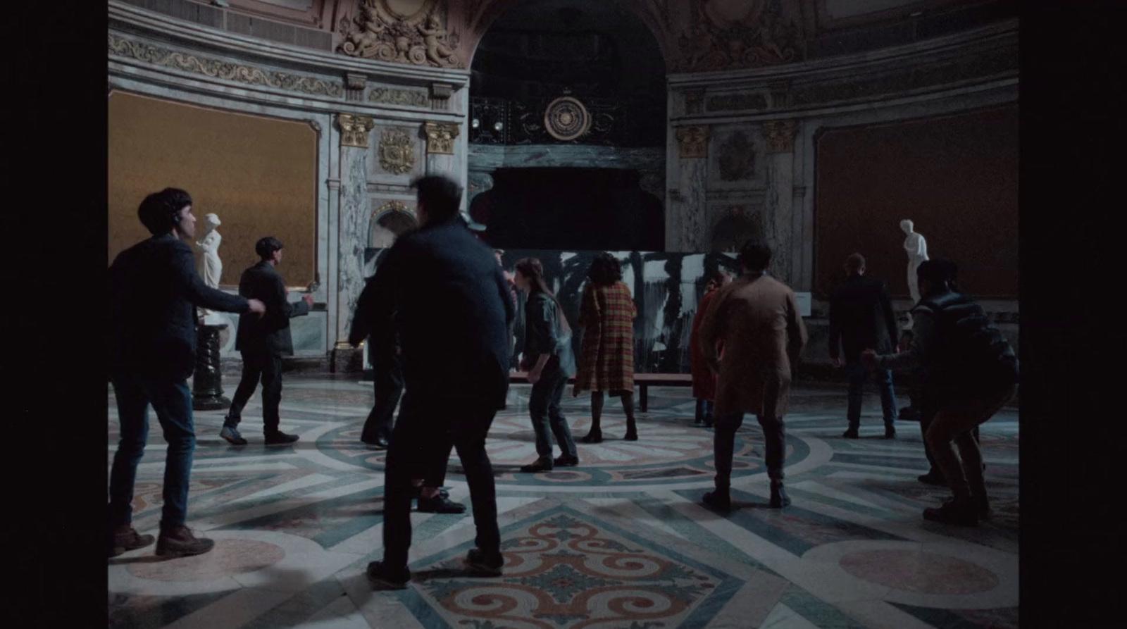 a group of people standing around in a room