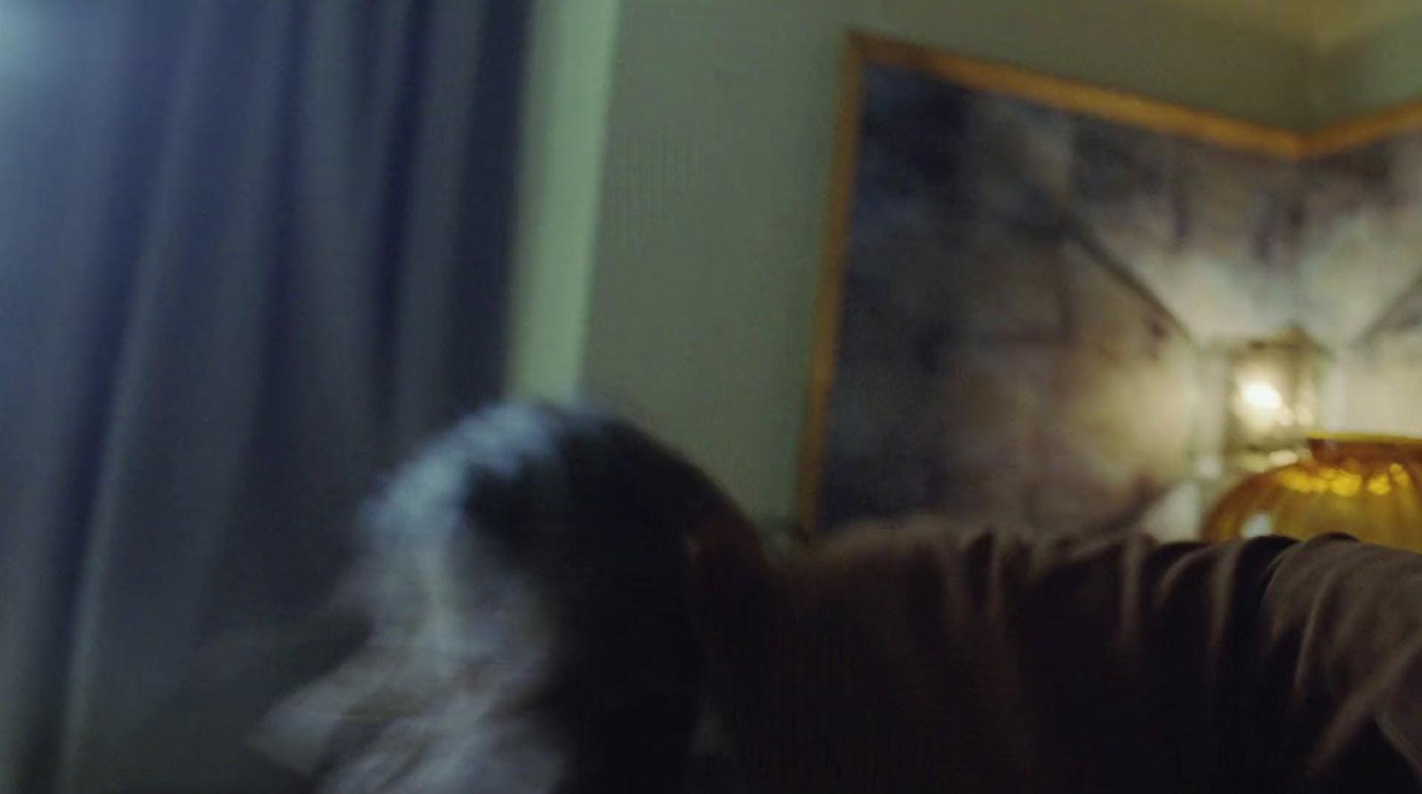 a blurry image of a man playing a video game