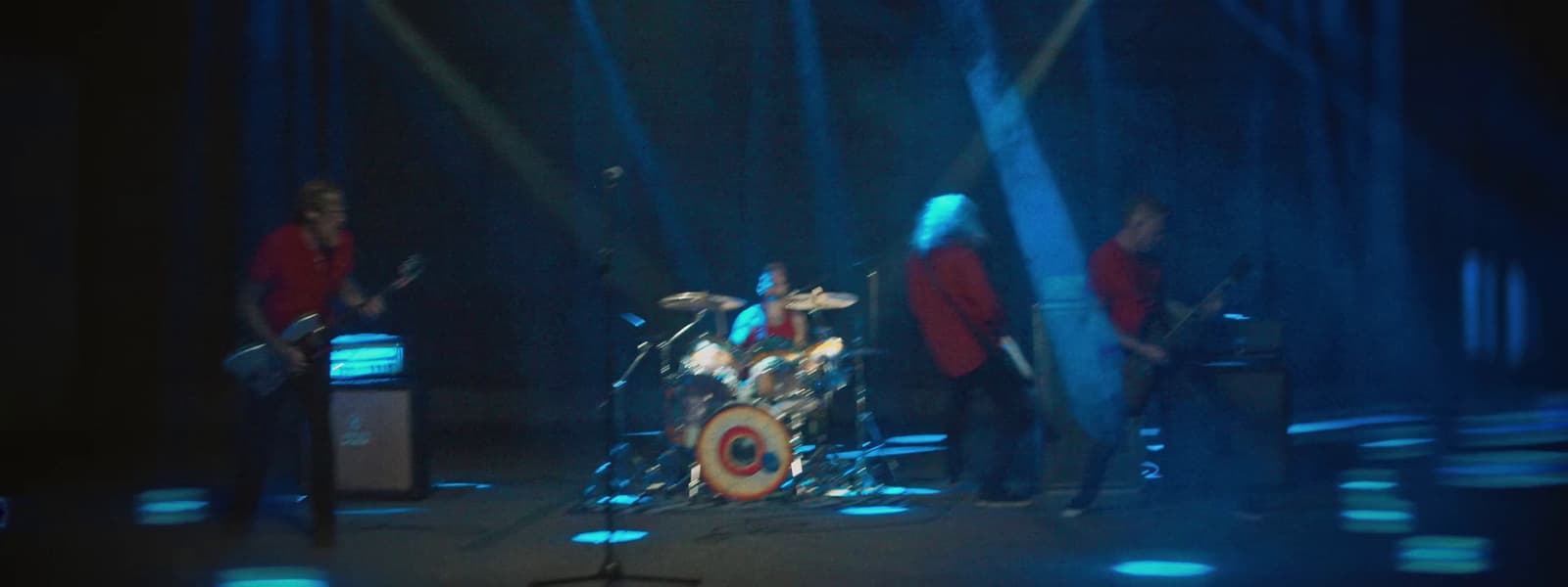 a group of people that are standing on a stage