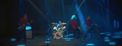 a group of people that are standing on a stage