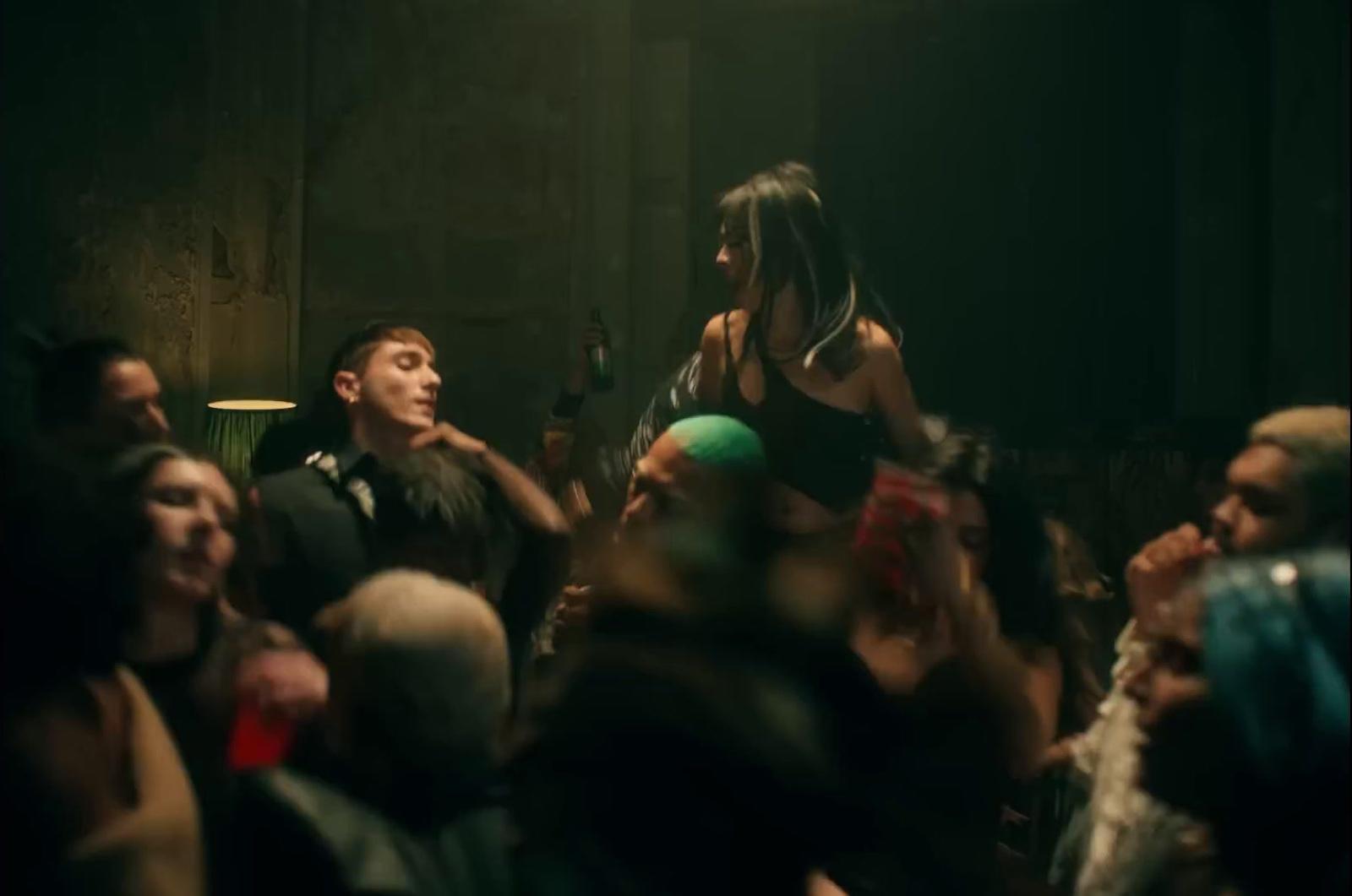 a group of people standing around each other